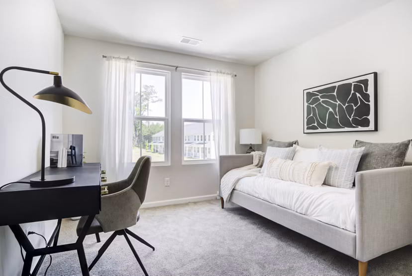 Cozy home office bedroom with natural light at Berkeley Homes Apartments