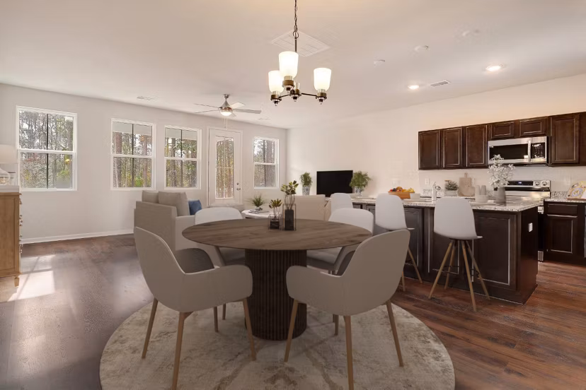 Elegant dining room with sleek furniture and modern lighting in Berkeley Homes Apartments