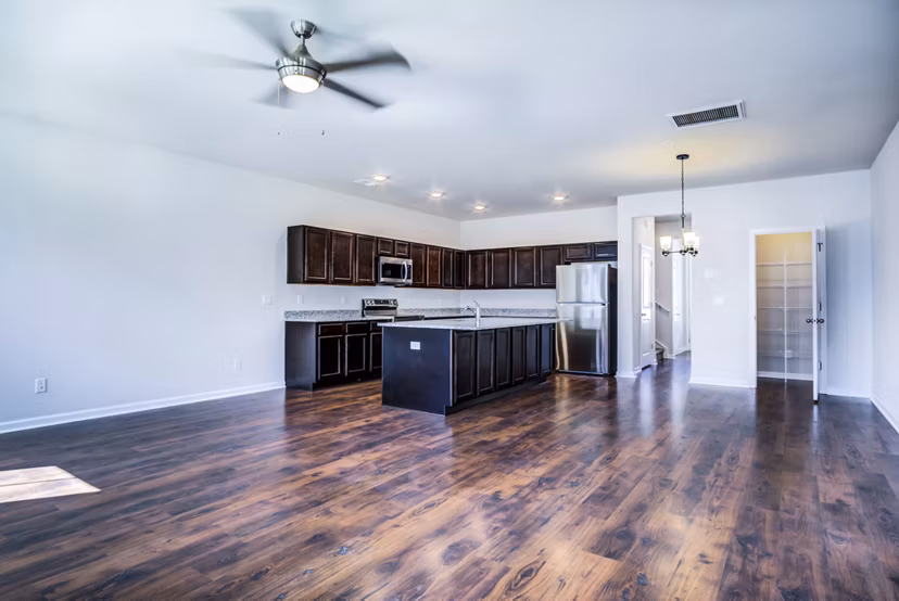 Open-concept dining and living room with modern decor at Berkeley Homes Apartments