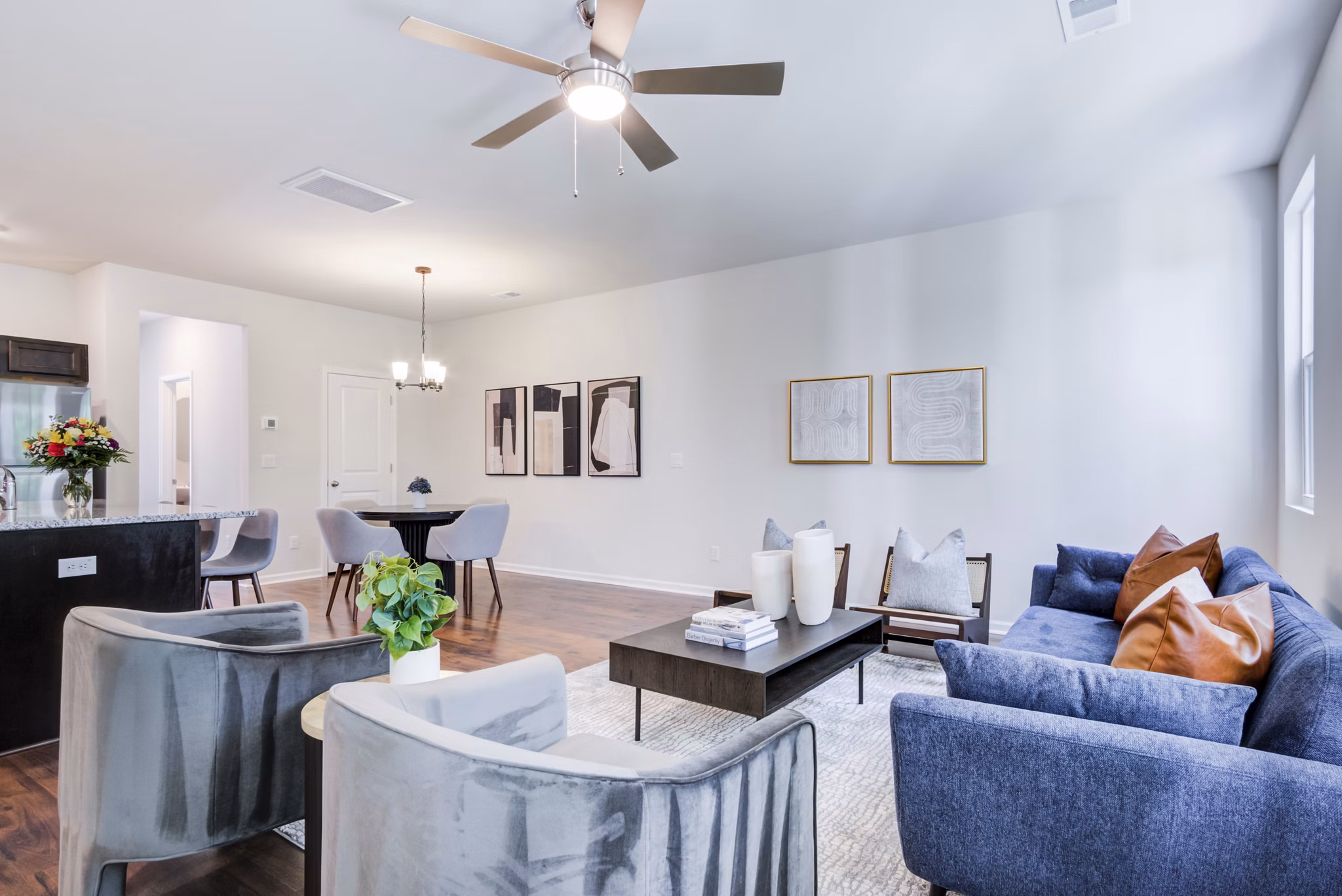 Living room with contemporary decor and ample natural light in Berkeley Homes Apartments