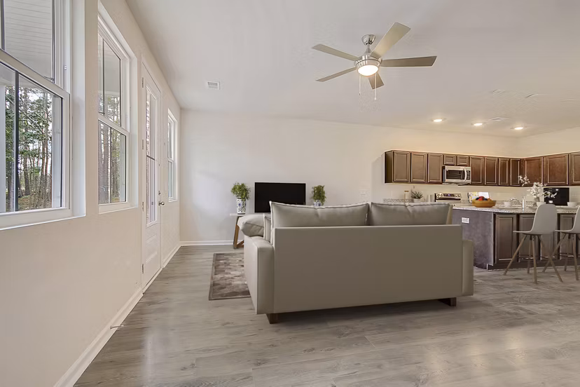 Spacious living room with modern decor at Berkeley Homes Apartments