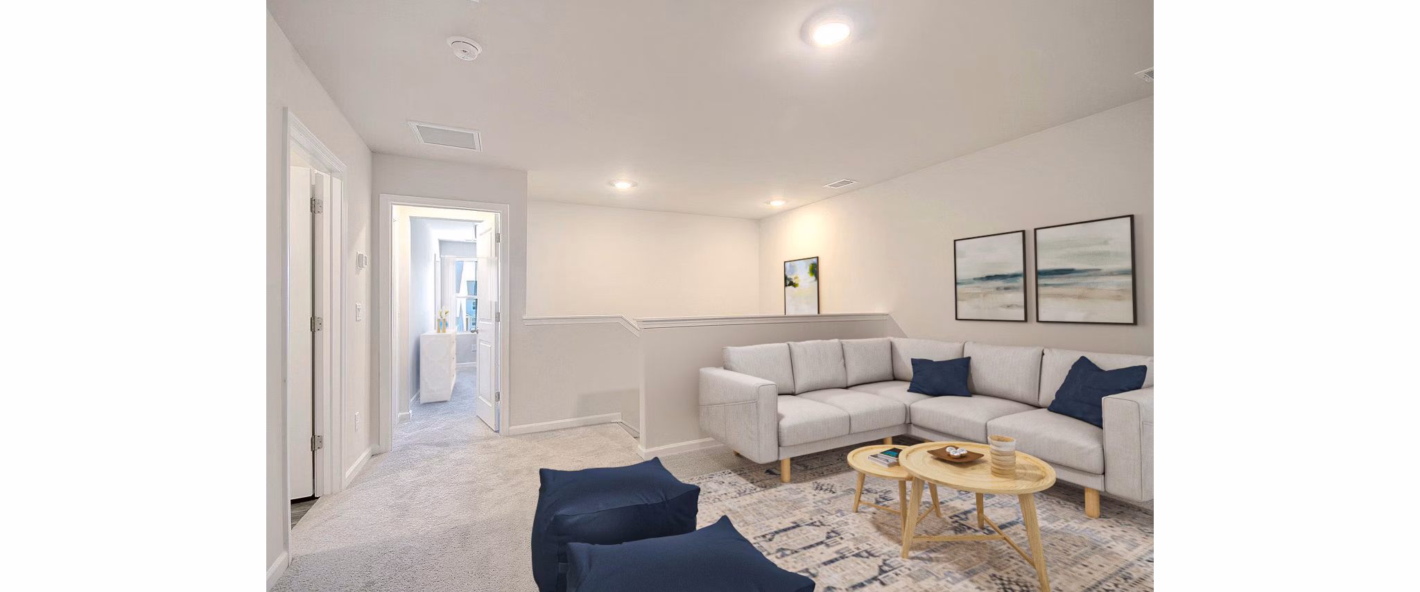 Spacious upstairs living room with modern furnishings at Berkeley Homes Apartments