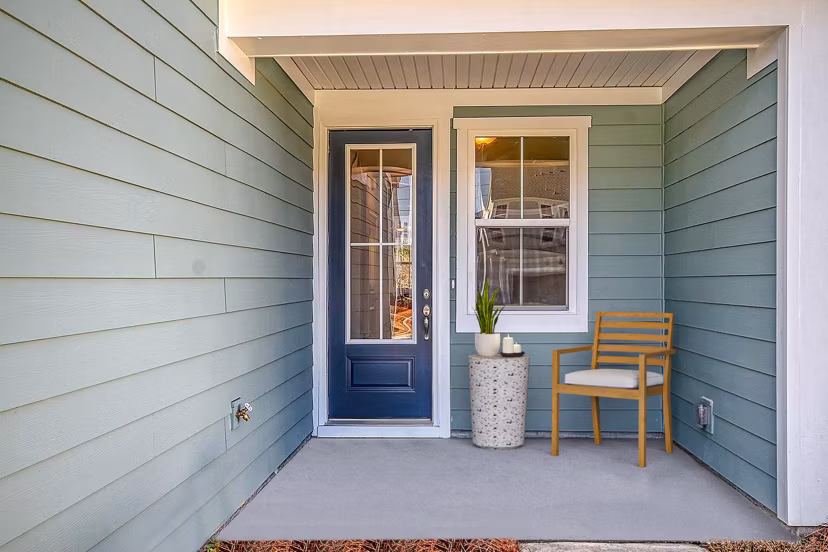 Patio with cozy seating at Berkeley Homes Apartments offering luxury living in a tranquil setting Perfect for relaxation and social gatherings