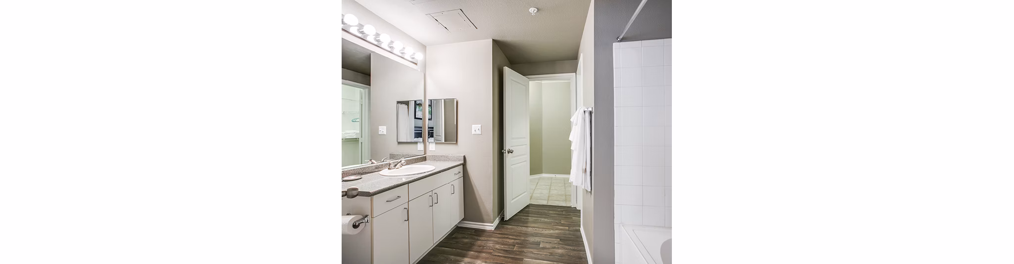 Modern bathroom with sleek fixtures in Equinox on the Park Apartments