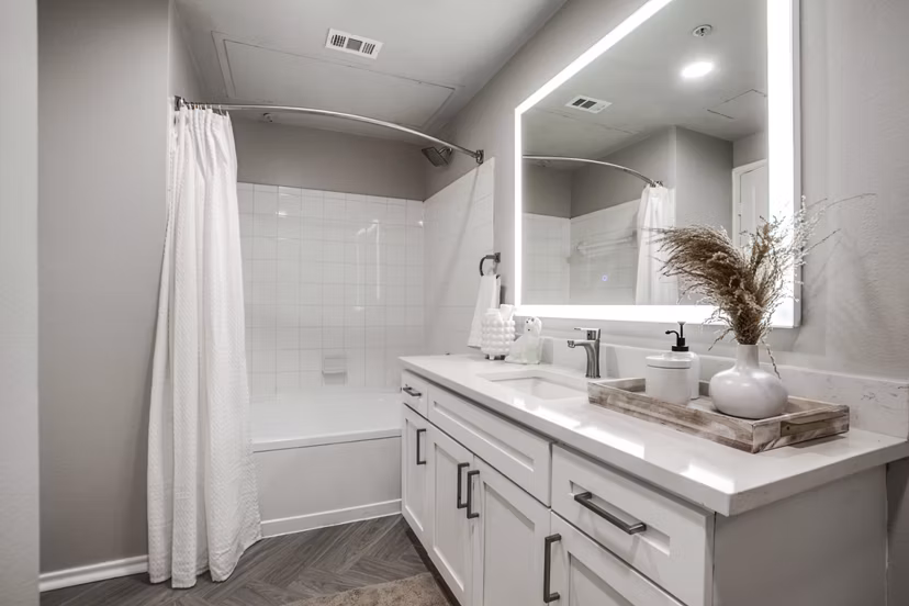 Modern bathroom with stylish fixtures at Equinox on the Park Apartments