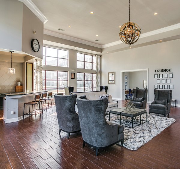 Modern clubhouse featuring stylish seating and gaming areas at Equinox on the Park Apartments