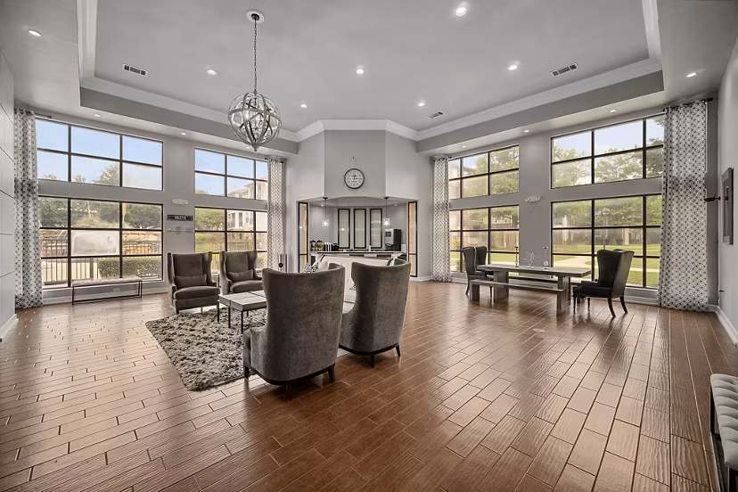 Modern clubhouse with stylish seating areas at Equinox on the Park Apartments