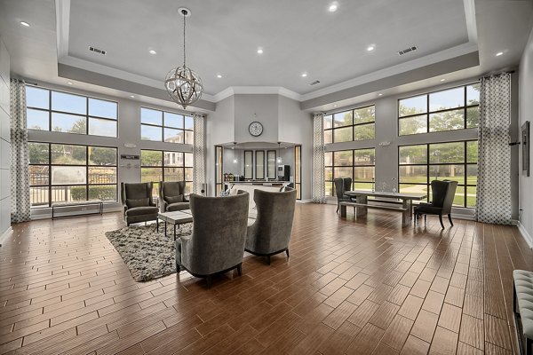 Modern clubhouse with stylish seating areas at Equinox on the Park Apartments