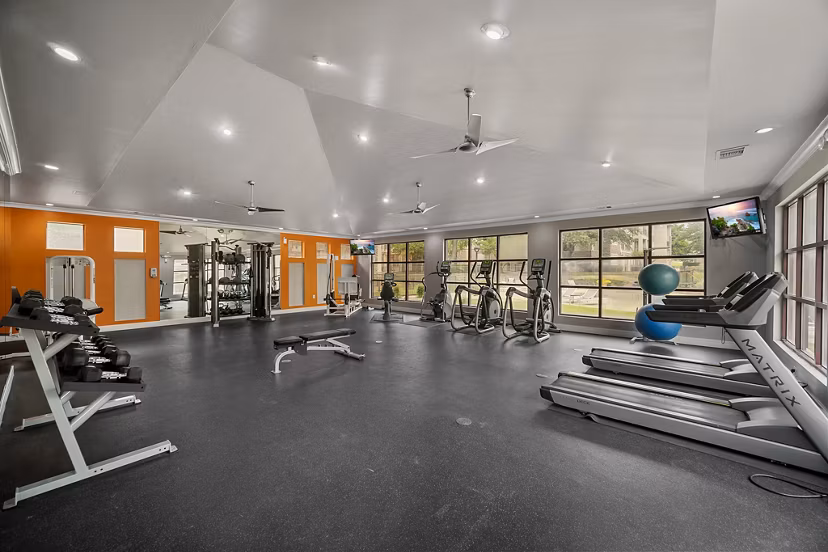 Modern fitness center with state-of-the-art equipment at Equinox on the Park Apartments, perfect for an active lifestyle