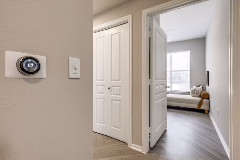 Contemporary hallway with sleek lighting at Equinox on the Park Apartments