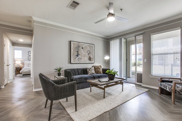 Spacious living room with modern decor at Equinox on the Park Apartments
