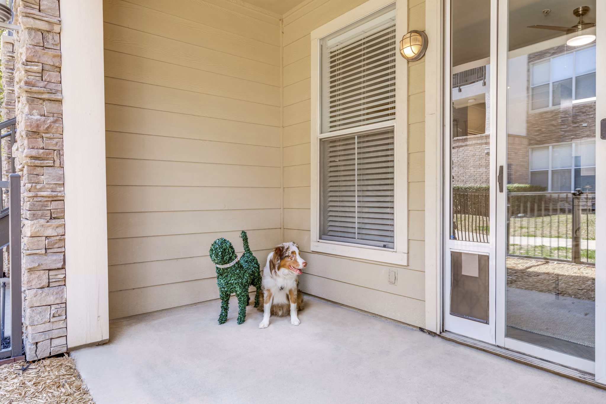 Patio with modern furniture at Equinox on the Park Apartments offering luxurious outdoor living