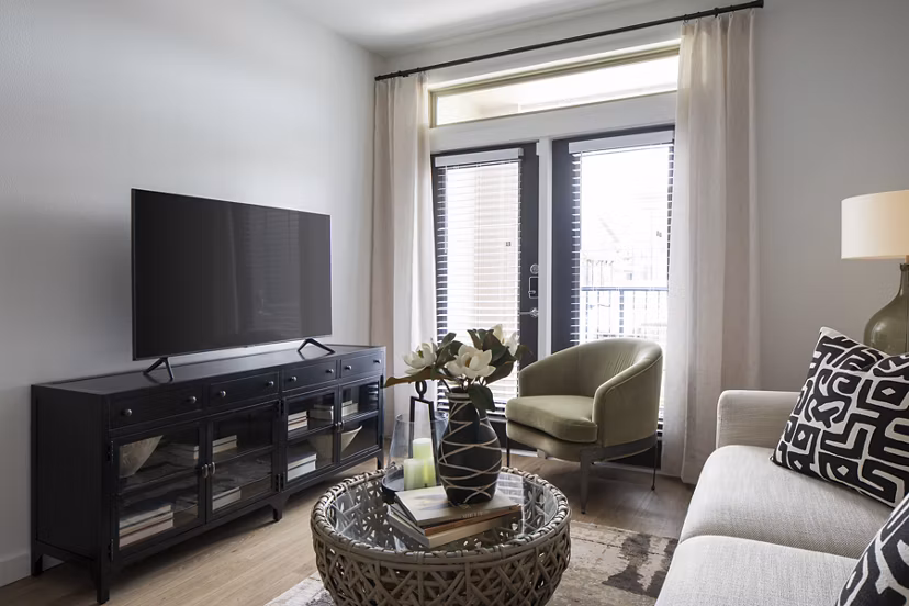 Spacious living room with modern decor in Broadstone Cross Creek Ranch Apartments