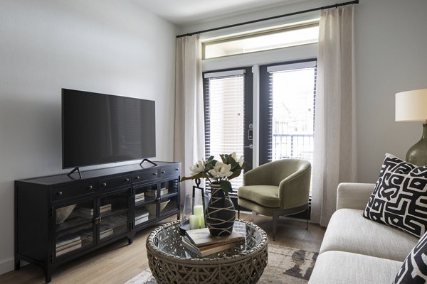Spacious living room with modern decor in Broadstone Cross Creek Ranch Apartments