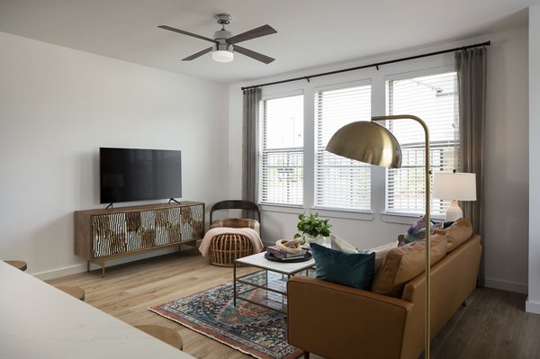 Open-concept living room with contemporary decor at Broadstone Cross Creek Ranch Apartments