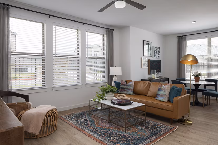 Spacious living room with modern furnishings in Broadstone Cross Creek Ranch Apartments