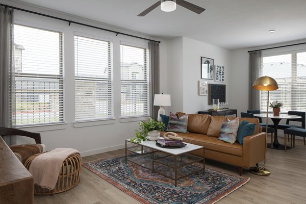 Spacious living room with modern furnishings in Broadstone Cross Creek Ranch Apartments