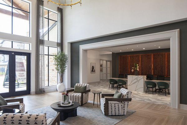 Modern clubhouse featuring lounge seating and billiards at Broadstone Cross Creek Ranch Apartments