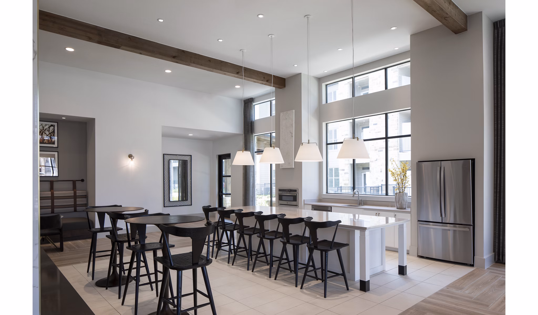 Modern clubhouse featuring a cozy lounge and meeting spaces at Broadstone Cross Creek Ranch Apartments in a lush setting