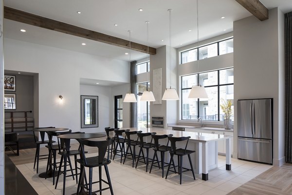 Modern clubhouse featuring a cozy lounge and meeting spaces at Broadstone Cross Creek Ranch Apartments in a lush setting