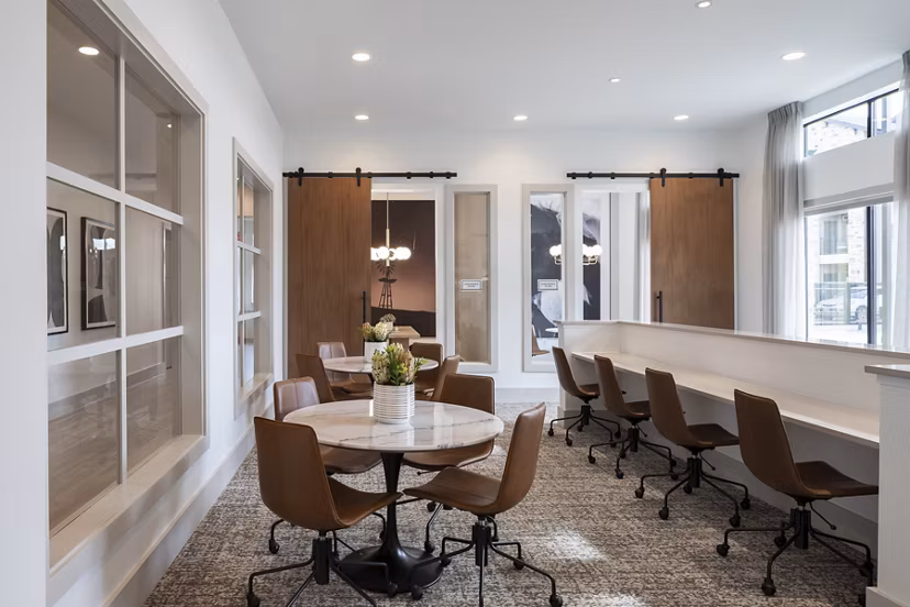 State-of-the-art meeting facility at Broadstone Cross Creek Ranch Apartments with modern decor and essential amenities for business needs