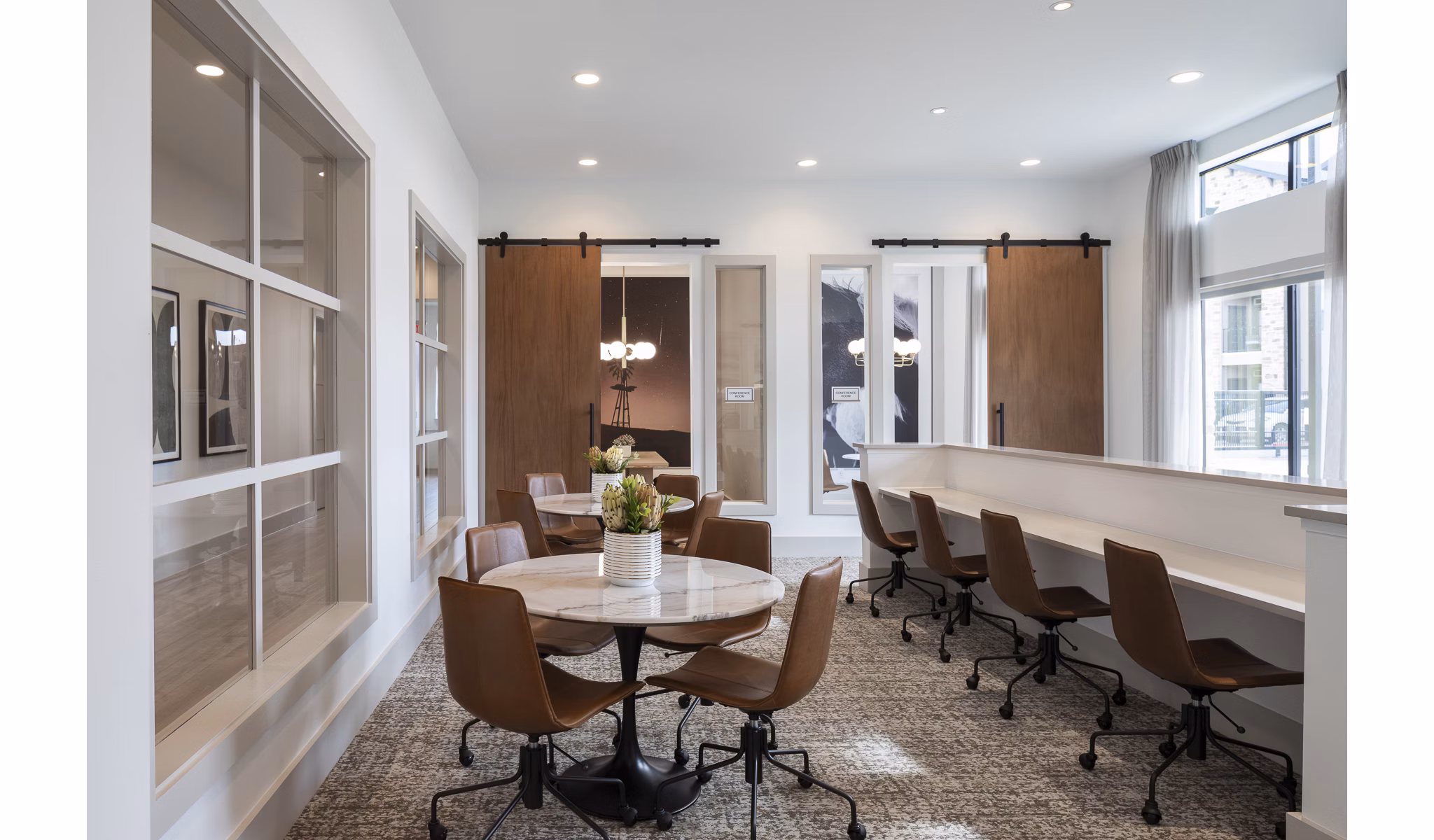 State-of-the-art meeting facility at Broadstone Cross Creek Ranch Apartments with modern decor and essential amenities for business needs