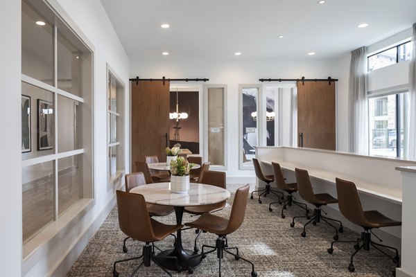 State-of-the-art meeting facility at Broadstone Cross Creek Ranch Apartments with modern decor and essential amenities for business needs