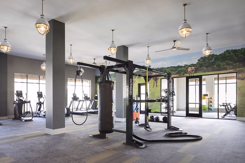 Modern fitness center equipped with cardio and strength machines at Broadstone Cross Creek Ranch Apartments