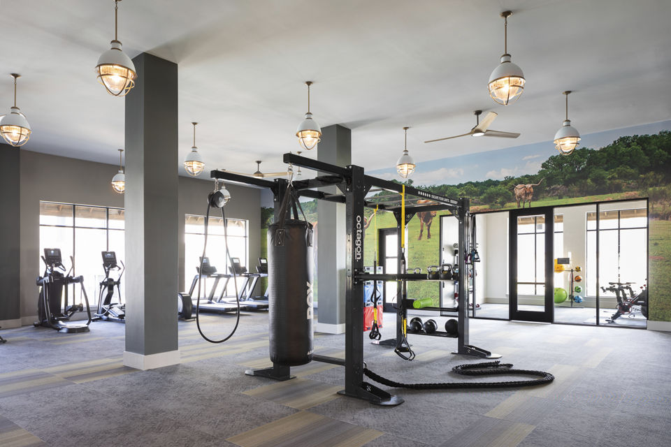 Modern fitness center equipped with cardio and strength machines at Broadstone Cross Creek Ranch Apartments