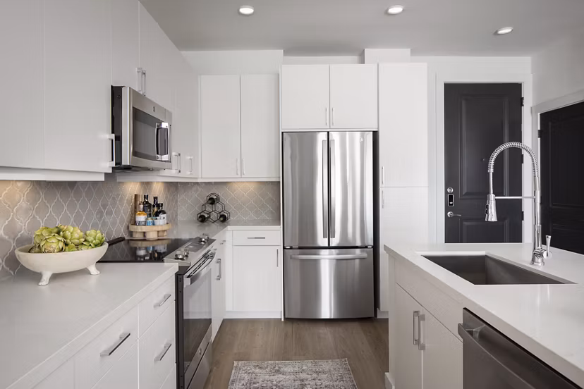 Modern kitchen with granite countertops and stainless steel appliances at Broadstone Cross Creek Ranch Apartments