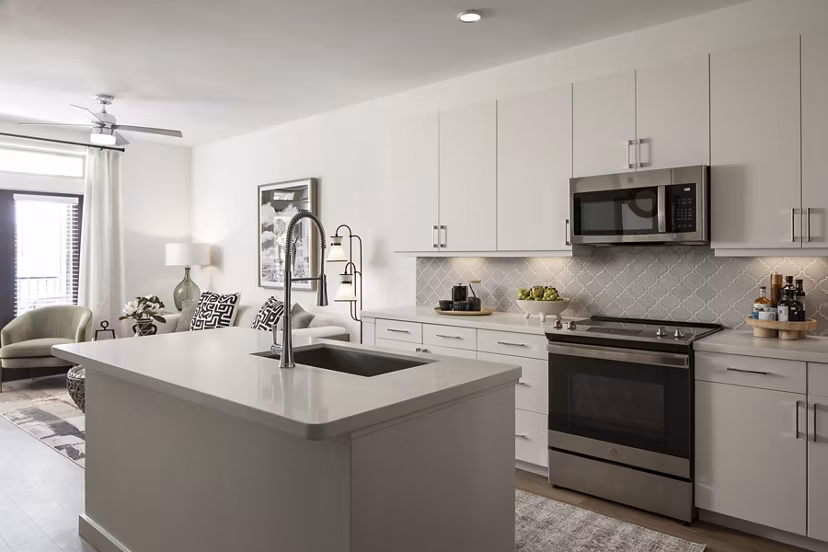 Modern kitchen with stainless steel appliances and island at Broadstone Cross Creek Ranch Apartments