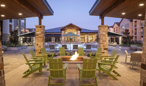 Inviting outdoor fire pit area at Broadstone Cross Creek Ranch Apartments