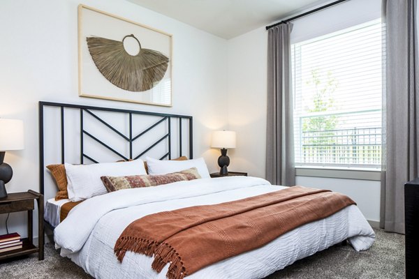 Cozy bedroom with modern design at Broadstone Jordan Ranch Apartments