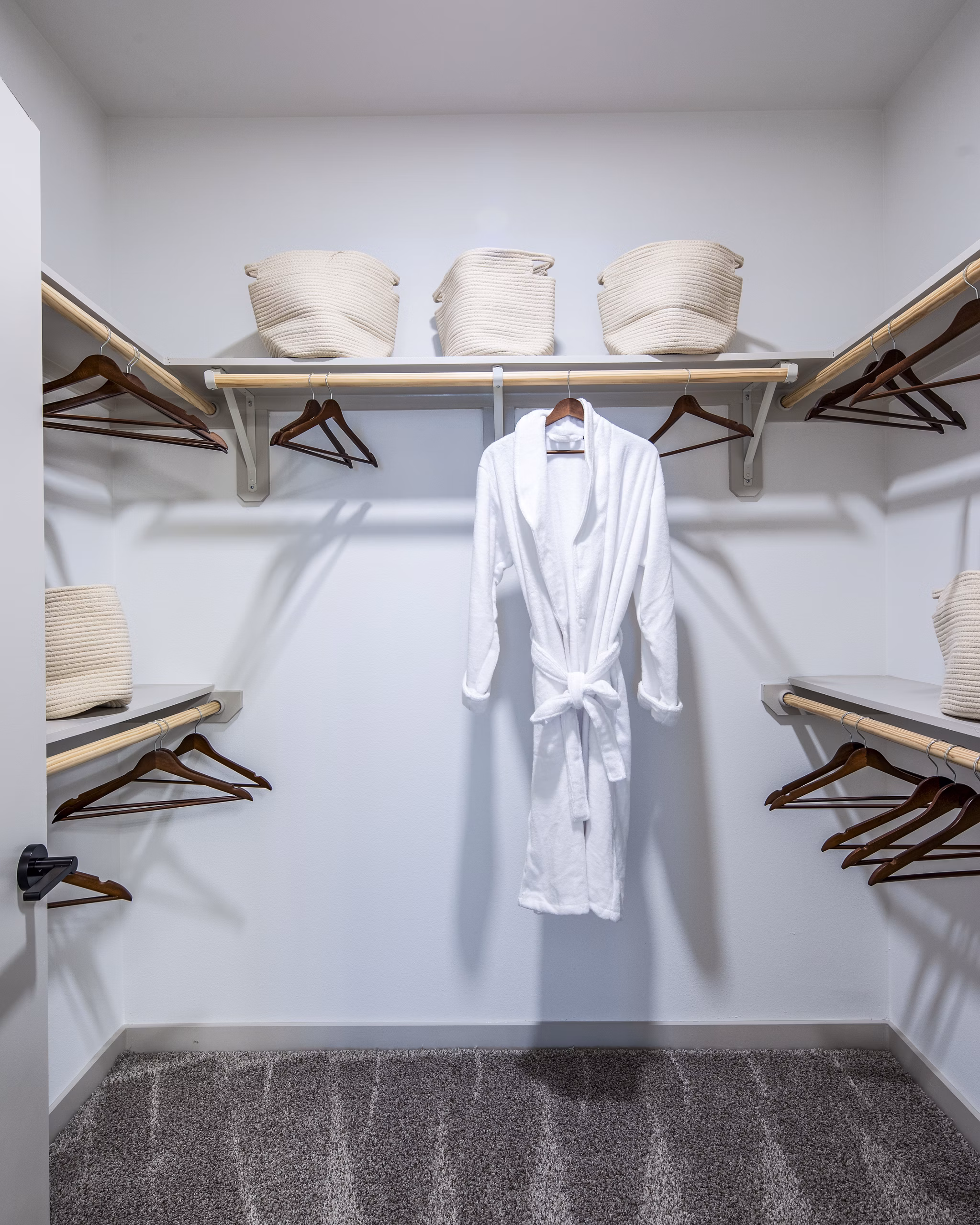 Walk-in bedroom closet with ample shelving at Broadstone Jordan Ranch Apartments, offering luxury living spaces in a vibrant community