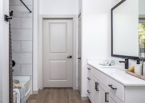 Modern bathroom with sleek fixtures and marble countertops in Broadstone Jordan Ranch Apartments