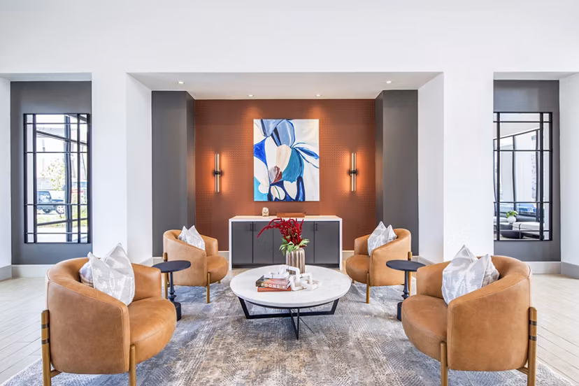 Modern clubhouse with lounge seating at Broadstone Jordan Ranch Apartments offering luxury amenities in Fulshear