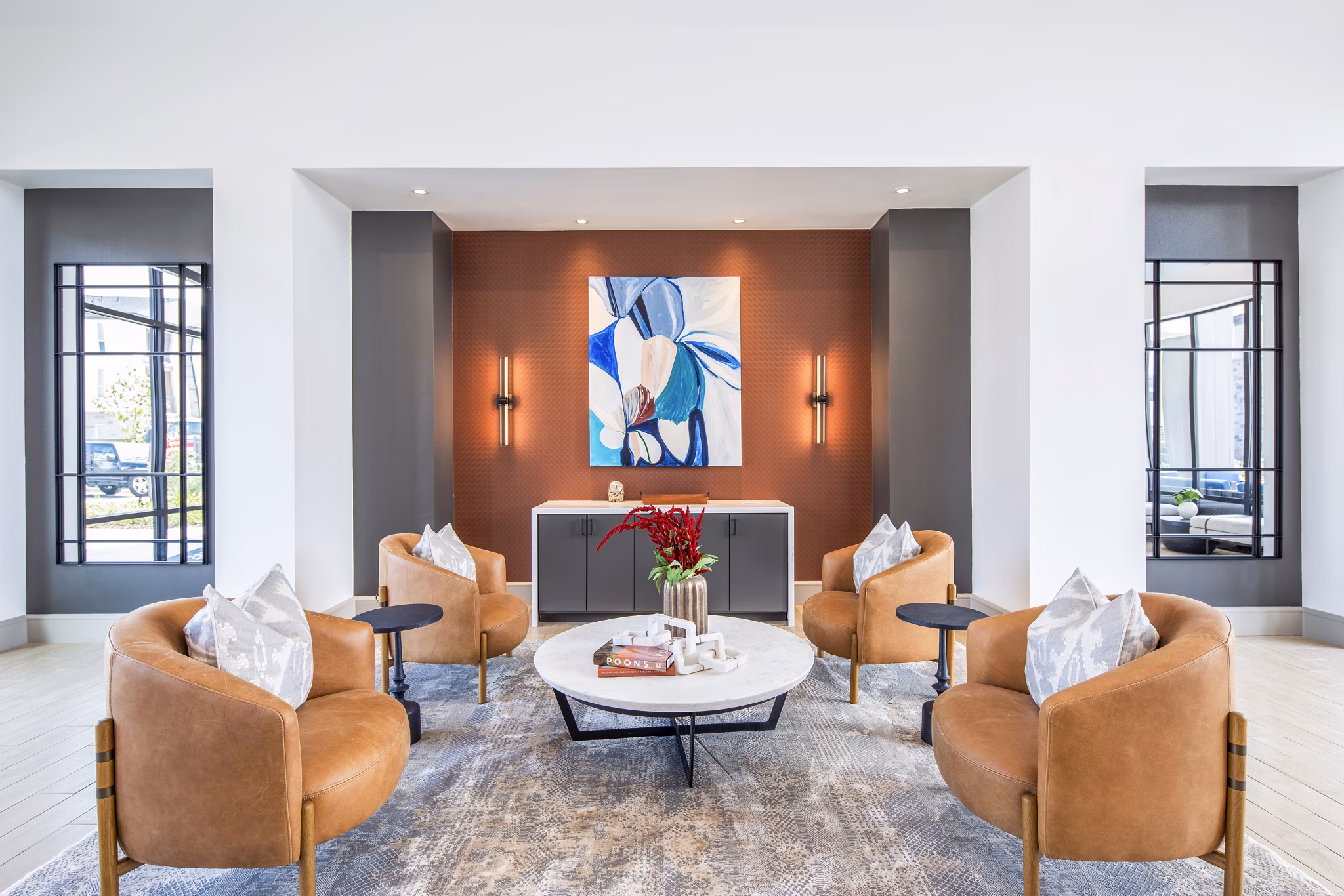 Modern clubhouse with lounge seating at Broadstone Jordan Ranch Apartments offering luxury amenities in Fulshear