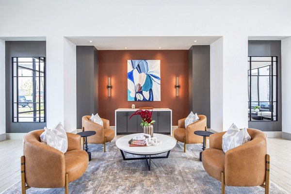 Modern clubhouse with lounge seating at Broadstone Jordan Ranch Apartments offering luxury amenities in Fulshear