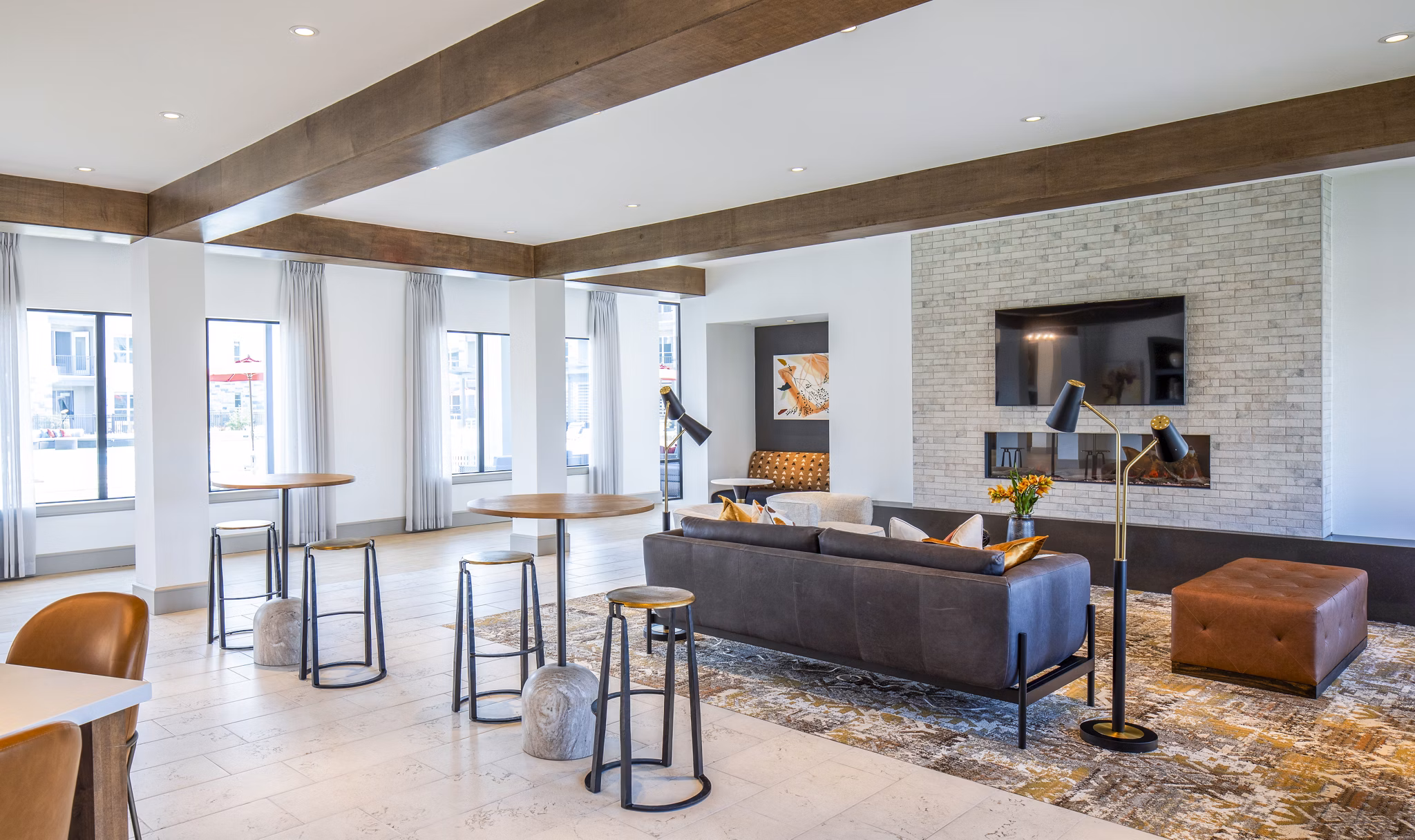 Modern clubhouse with luxurious seating and open layout at Broadstone Jordan Ranch Apartments