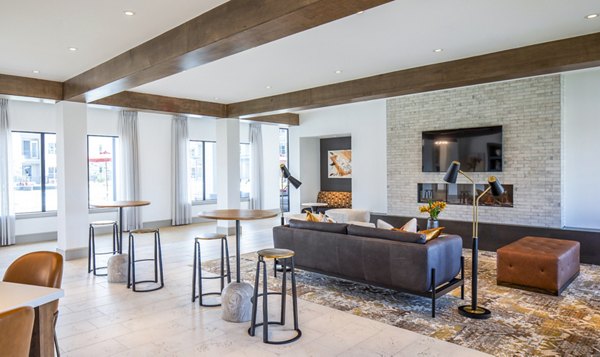 Modern clubhouse with luxurious seating and open layout at Broadstone Jordan Ranch Apartments