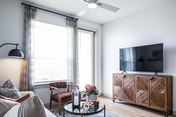Spacious living room with modern furnishings at Broadstone Jordan Ranch Apartments