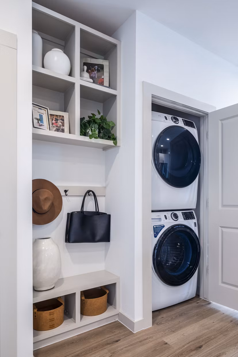 Laundry room featuring modern appliances at Broadstone Jordan Ranch Apartments