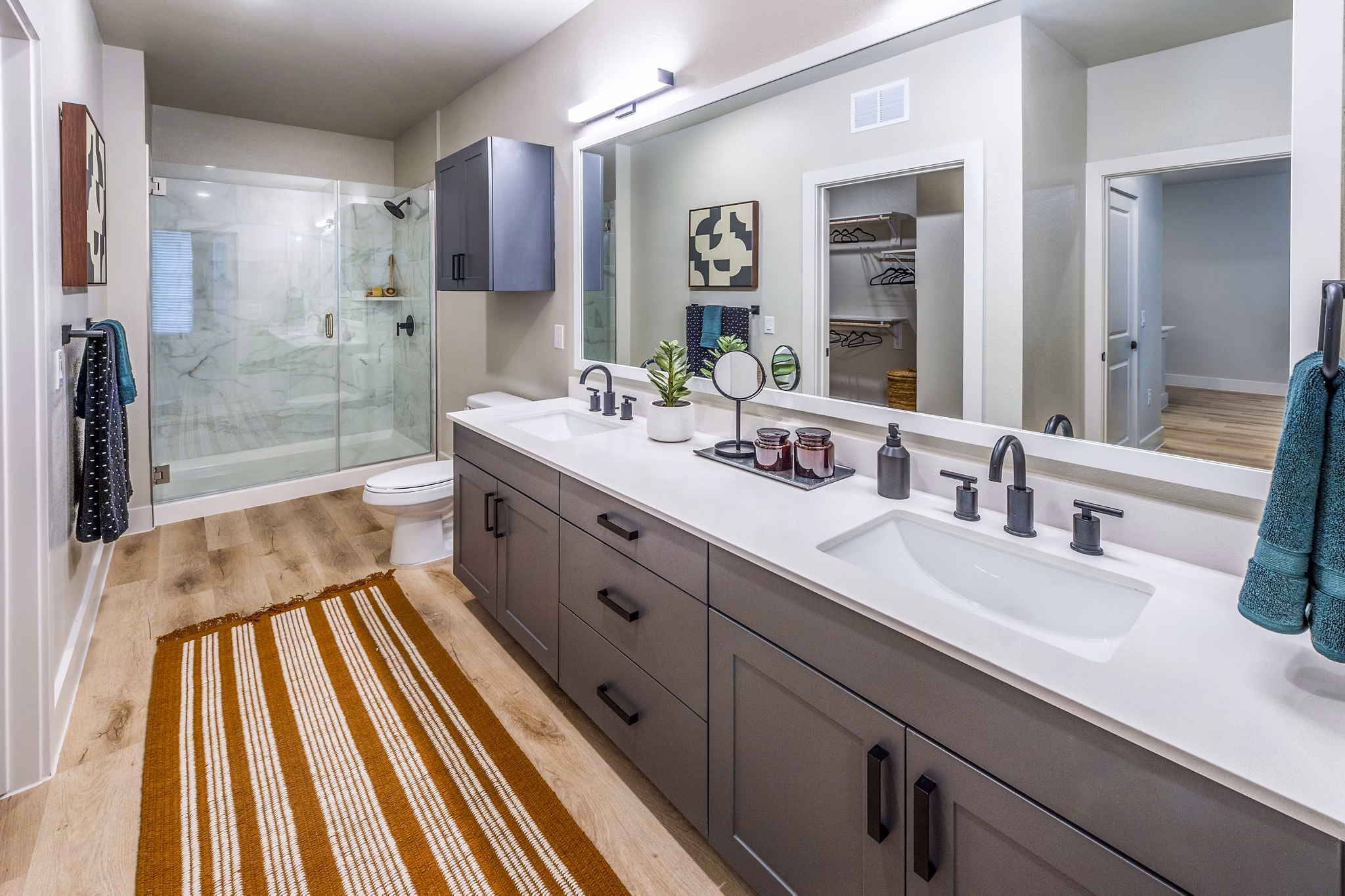 Bathroom with modern fixtures and stylish tile work at Lenox Grand West Apartments