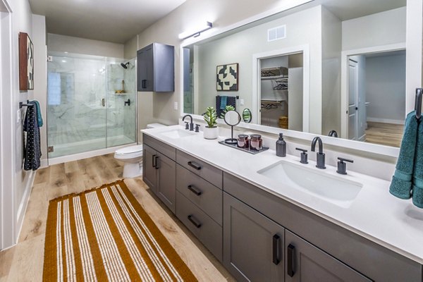 Bathroom with modern fixtures and stylish tile work at Lenox Grand West Apartments