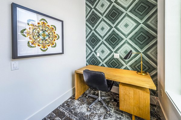 Clubhouse office with modern seating and workstations at Lenox Grand West Apartments