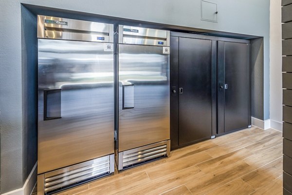 Modern clubhouse with stainless steel refrigerators at Lenox Grand West Apartments in luxury living community