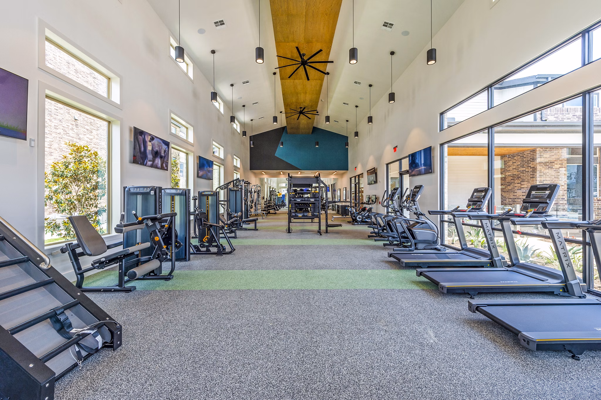 State-of-the-art fitness center with modern equipment at Lenox Grand West Apartments