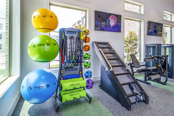 Fitness center with modern equipment at Lenox Grand West Apartments, offering a premium workout experience in a luxurious setting