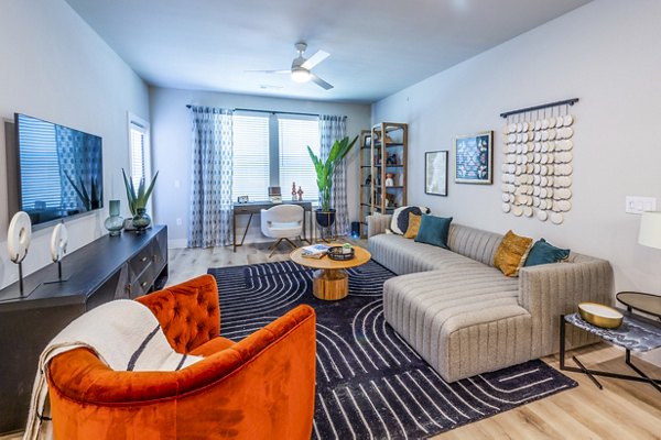 Spacious living room with modern furnishings at Lenox Grand West Apartments