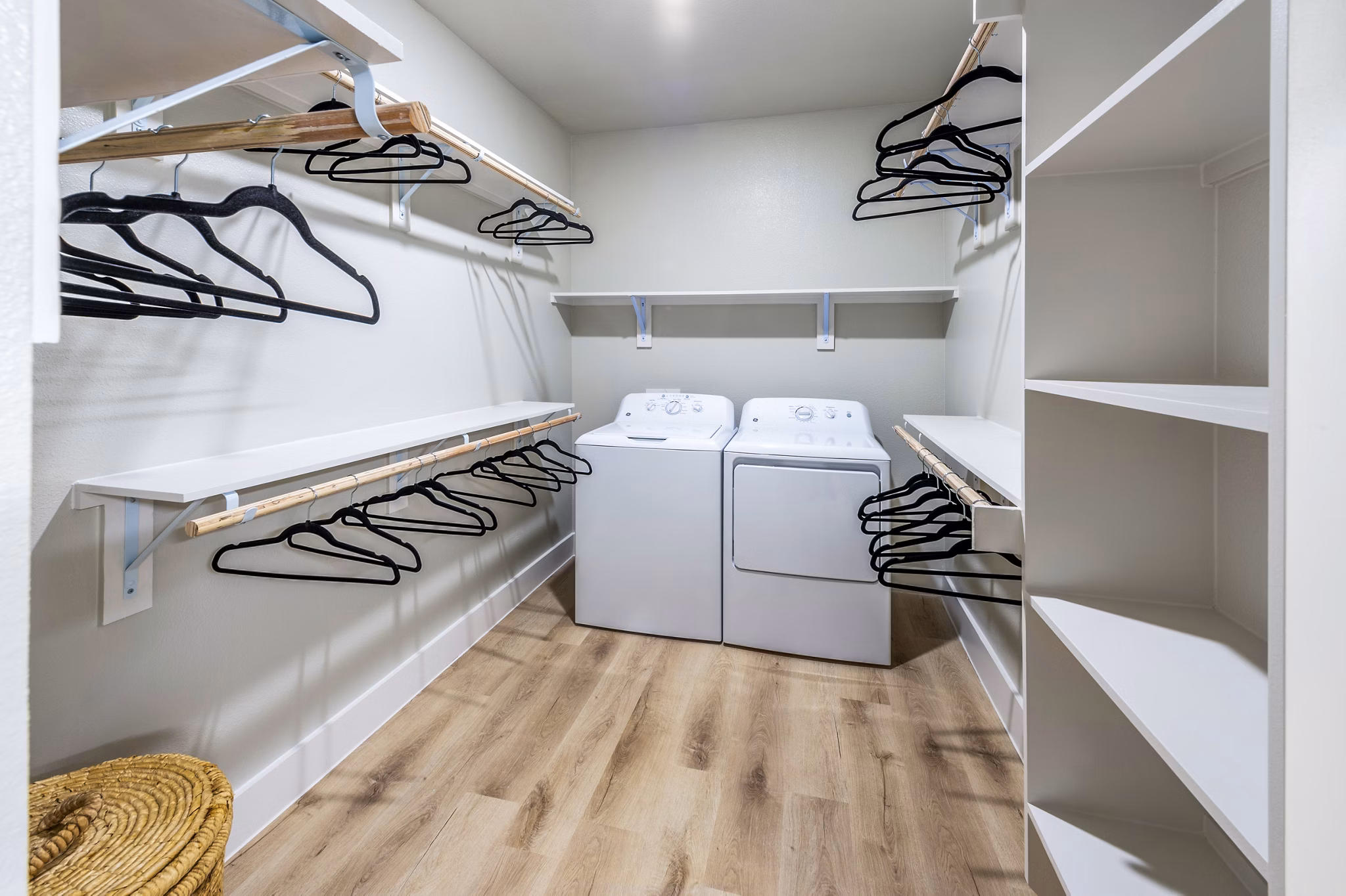 Lenox Grand West Apartments: Laundry room with energy-efficient machines and ample storage space